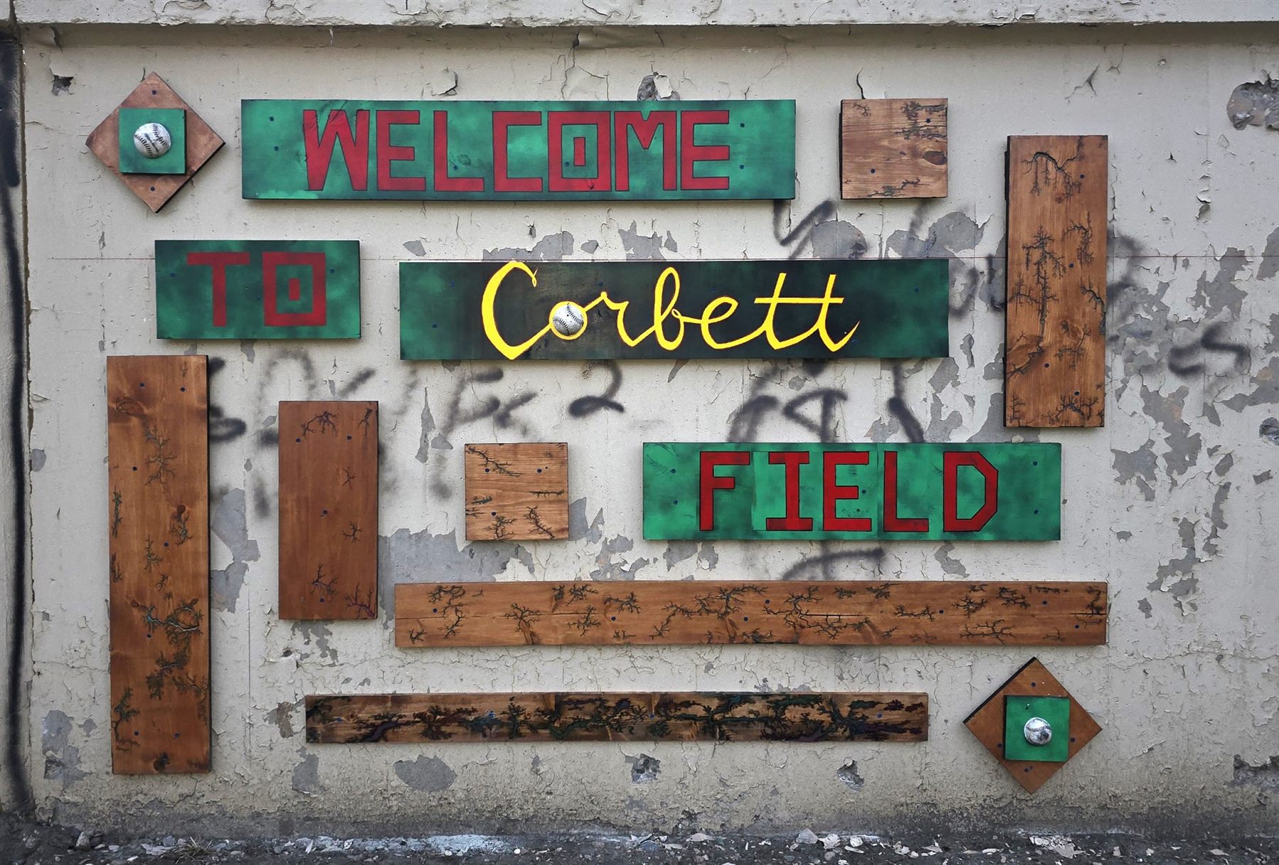 Welcome to Corbett Field, with real baseballs worked into the lettering